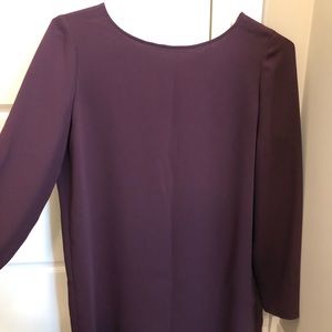 Babaton blouse, open back with one button